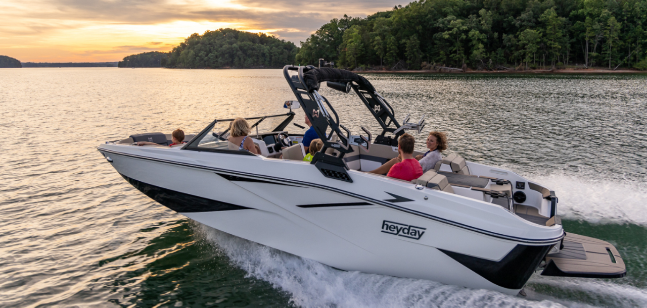 Family Riding in Heyday H22 Wake Boat, Port-Side View, Underway