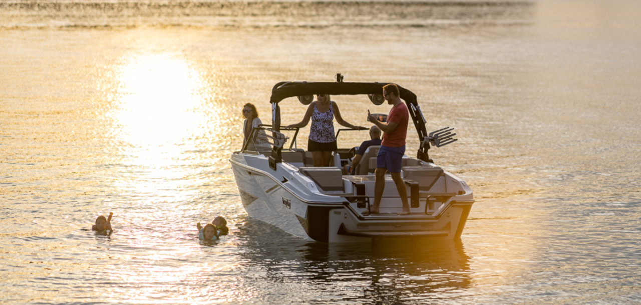 Family on Heyday H22 Wake Boat, Stern-View, Boat Anchored