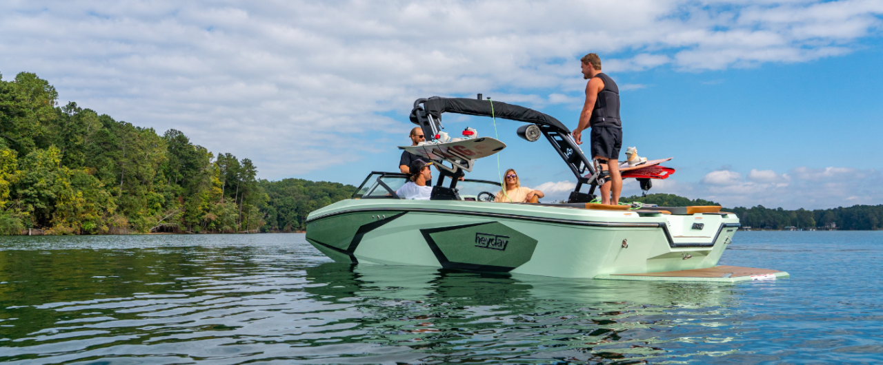 People getting ready to wakeboard on the Heyday H22