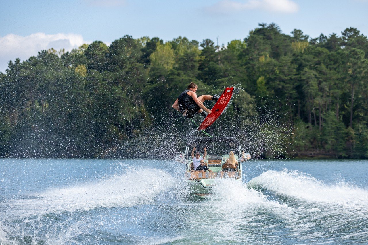 wakeboarder up in the air behind the WT2-DC wake boat